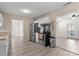 Bright kitchen featuring stainless steel appliances, white cabinets and a view to the patio at 443 Picadilly Ln, Troutman, NC 28166