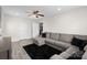 Living Room featuring a large sectional couch and a mounted television, perfect for entertaining guests at 443 Picadilly Ln, Troutman, NC 28166