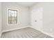 A simple bedroom featuring gray carpet, a double-door closet and a window at 5230 Club View Dr, Concord, NC 28025