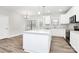 Bright, modern kitchen features a large island, stainless appliances, and hardwood flooring at 5230 Club View Dr, Concord, NC 28025