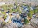 Community view shows townhouses, trees, and parking at 5702 Prescott Ct, Charlotte, NC 28269