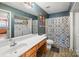 Clean bathroom with a shower/tub combo and laundry area at 5702 Prescott Ct, Charlotte, NC 28269