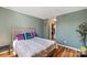 Bedroom with hardwood floors and a walk-in closet at 5702 Prescott Ct, Charlotte, NC 28269