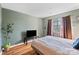 Bedroom with hardwood floors and large window at 5702 Prescott Ct, Charlotte, NC 28269