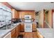 Kitchen boasts ample counter space and white appliances at 5702 Prescott Ct, Charlotte, NC 28269