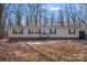 Single-story home with gray siding and brick base at 5826 Boxer Dr, Iron Station, NC 28080