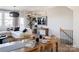 Light-filled dining area features a large wooden table, modern chairs, and stylish decor at 7015 Impulse Ct, Charlotte, NC 28205