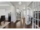 Bright foyer with hardwood floors, staircase, and access to other rooms at 7070 Founders Way, Harrisburg, NC 28075