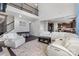 Two story living room with sectional sofa and stone fireplace at 7070 Founders Way, Harrisburg, NC 28075