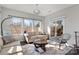 Bright sunroom with comfy seating and access to a deck at 7070 Founders Way, Harrisburg, NC 28075