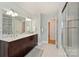 Elegant bathroom with double vanity and large shower at 7135 Folger Dr, Charlotte, NC 28270