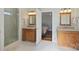 Updated bathroom with granite countertops, tile floors, and a glass-enclosed shower at 7135 Folger Dr, Charlotte, NC 28270