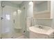 Bright bathroom featuring a glass enclosed shower, built in seat, and a stylish modern sink at 7135 Folger Dr, Charlotte, NC 28270