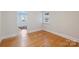Empty room ready for personalization, showing hardwood floors and natural light at 7135 Folger Dr, Charlotte, NC 28270