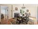 Formal dining room featuring a classic chandelier, fireplace, and elegant wood table with seating at 7135 Folger Dr, Charlotte, NC 28270