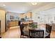Eat-in kitchen with wooden cabinets, granite counters, and stainless steel appliances at 7135 Folger Dr, Charlotte, NC 28270
