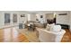 Bright living room with hardwood floors, neutral furniture, and stylish side tables at 7135 Folger Dr, Charlotte, NC 28270
