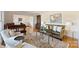 Cozy living room showcasing hardwood floors, stylish furniture, and a beautiful oriental rug at 7135 Folger Dr, Charlotte, NC 28270