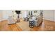 Bright living room with hardwood floors, neutral furniture, and stylish side tables at 7135 Folger Dr, Charlotte, NC 28270