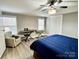 Bedroom with king-size bed, ceiling fan and sitting area at 758 Shannon Meadows Rd, Clover, SC 29710