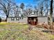 Tan mobile home with a covered porch and brick skirting at 758 Shannon Meadows Rd, Clover, SC 29710