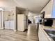 Updated kitchen with white cabinets, stainless steel appliances and in-unit laundry at 758 Shannon Meadows Rd, Clover, SC 29710