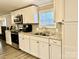 Modern kitchen with white cabinets and stainless steel appliances at 758 Shannon Meadows Rd, Clover, SC 29710