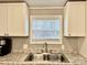 Modern kitchen sink with stainless steel double basin and granite countertop at 758 Shannon Meadows Rd, Clover, SC 29710