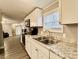 Clean kitchen with white cabinets, stainless steel appliances, and a view into the living room at 758 Shannon Meadows Rd, Clover, SC 29710