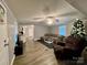 Open living room with sectional sofa, recliner, and view of kitchen at 758 Shannon Meadows Rd, Clover, SC 29710