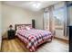 Bright bedroom with ample natural light, featuring a bed with a patterned comforter at 8115 Kingsland Dr, Waxhaw, NC 28173