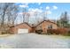 Charming home featuring an attached two-car garage and gravel driveway at 8115 Kingsland Dr, Waxhaw, NC 28173