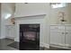 Gas fireplace with a modern mantel and black granite surround at 900 Raffaelo Vw, Mount Holly, NC 28120