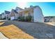 House exterior with stone and siding, covered porch and landscaping at 900 Raffaelo Vw, Mount Holly, NC 28120