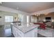 Kitchen island with granite countertop and breakfast bar seating at 900 Raffaelo Vw, Mount Holly, NC 28120