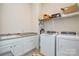 Bright laundry room with washer, dryer and built-in shelving at 900 Raffaelo Vw, Mount Holly, NC 28120