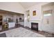 Open concept living room with kitchen and fireplace visible at 900 Raffaelo Vw, Mount Holly, NC 28120