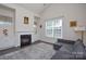 Living room features a gas fireplace and built-in shelving at 900 Raffaelo Vw, Mount Holly, NC 28120
