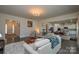 Open living room with hardwood floors, fireplace and view into the kitchen at 900 Raffaelo Vw, Mount Holly, NC 28120