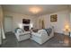 Living room features hardwood floors, a fireplace, and comfortable seating at 900 Raffaelo Vw, Mount Holly, NC 28120