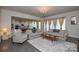 Open concept living room with hardwood floors and kitchen views at 900 Raffaelo Vw, Mount Holly, NC 28120