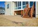 Brick paved patio with wooden stairs leading to a sunroom at 900 Raffaelo Vw, Mount Holly, NC 28120