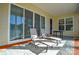 Sunroom with sliding glass doors, lounge chairs, and a small table at 900 Raffaelo Vw, Mount Holly, NC 28120