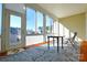 Sunroom with sliding glass doors, table and chairs, and view of the neighborhood at 900 Raffaelo Vw, Mount Holly, NC 28120