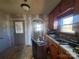 Under renovation kitchen with wood cabinets and double sink at 903 Belmont Mount Holly Rd, Belmont, NC 28012