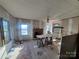 Under renovation living room with a brick fireplace at 903 Belmont Mount Holly Rd, Belmont, NC 28012