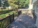 Expansive wooden deck with outdoor seating provides a relaxing space in the backyard at 9319 Pebble Creek Way, Charlotte, NC 28269