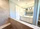 Elegant bathroom with large mirror, vanity, and tiled shower at 9657 Liberty Hill Dr, Mint Hill, NC 28227