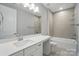 Well-lit bathroom with vanity, tub, shower, and modern fixtures at 9657 Liberty Hill Dr, Mint Hill, NC 28227