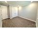 Comfortable bedroom with wood-look floors, crown molding, and a double door closet at 9657 Liberty Hill Dr, Mint Hill, NC 28227